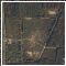 89 - Higher resolution color aerial photo. Note small dirt parking lot near gate and a model airplane runway near center of the picture.