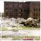 245 - Looking at a pile of debris with morgue in the background,taken when preparation for demolition began